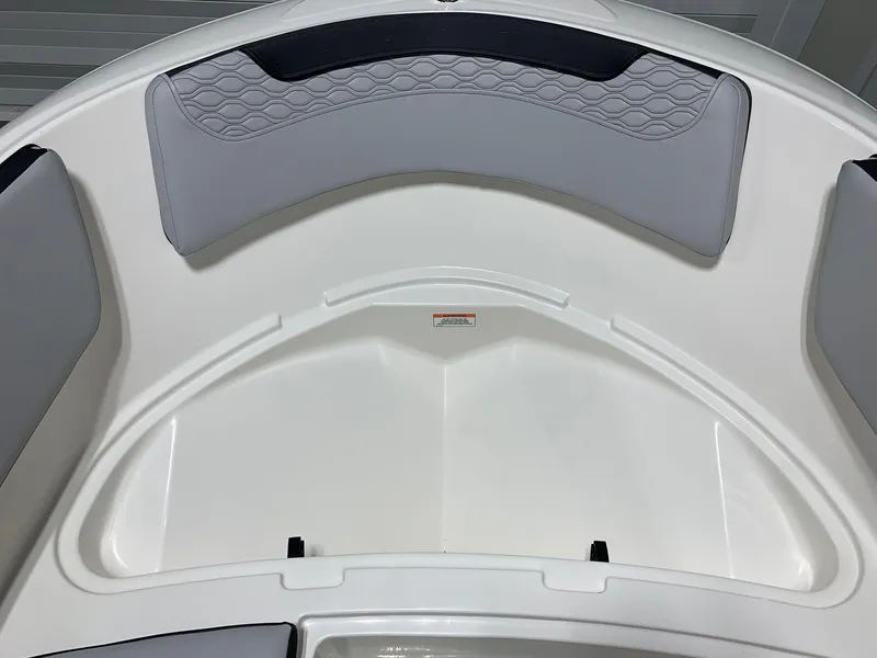 Slide: The Image of 2024 Bayliner Element M15 boat interior with cushioned seating. - 8