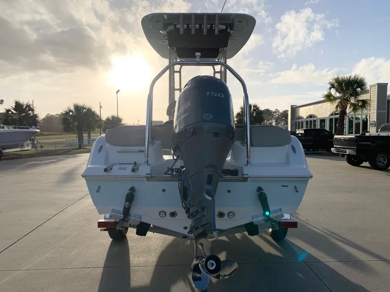 Slide: The Image of 2024 Key West 203 FS boat with Yamaha outboard motor at sunset. - 2