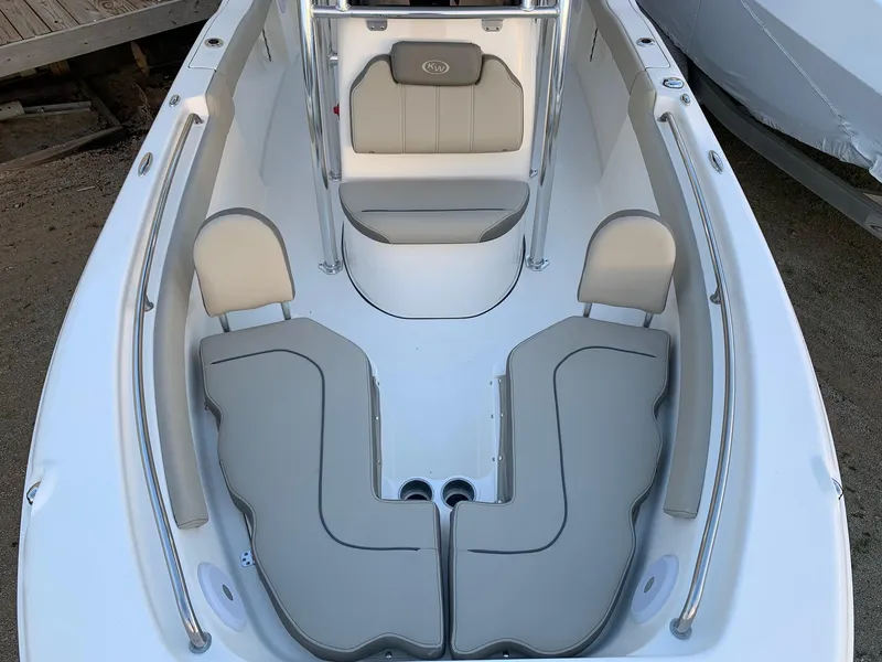 Slide: The Image of 2024 Key West 203 FS boat interior with cushioned seating and storage compartments. - 16