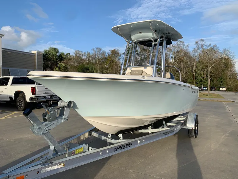 Slide: The Image of 2024 Key West 203 FS boat on trailer in parking lot. - 2