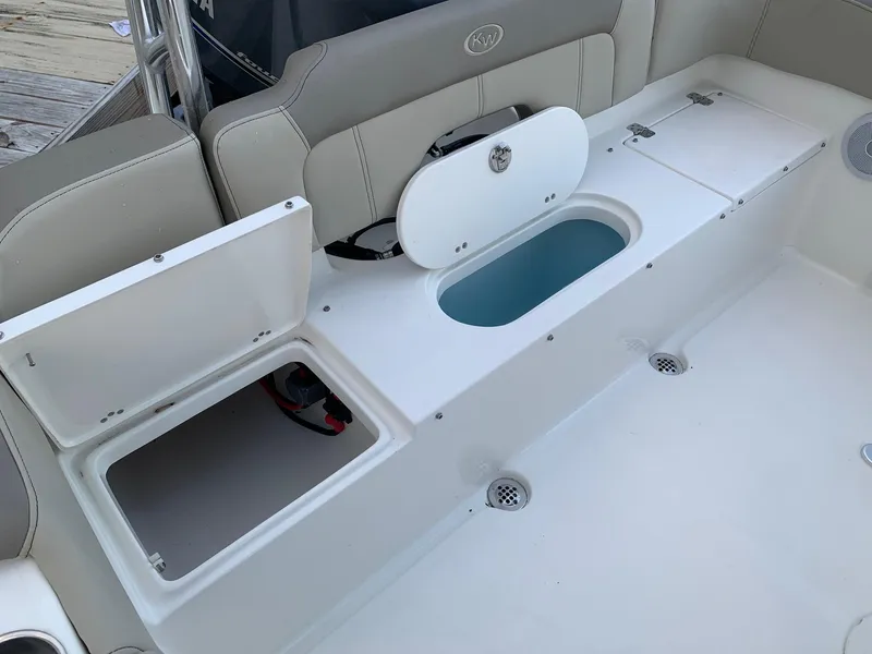 Slide: The Image of 2024 Key West 203 FS boat interior with open storage compartments. - 6