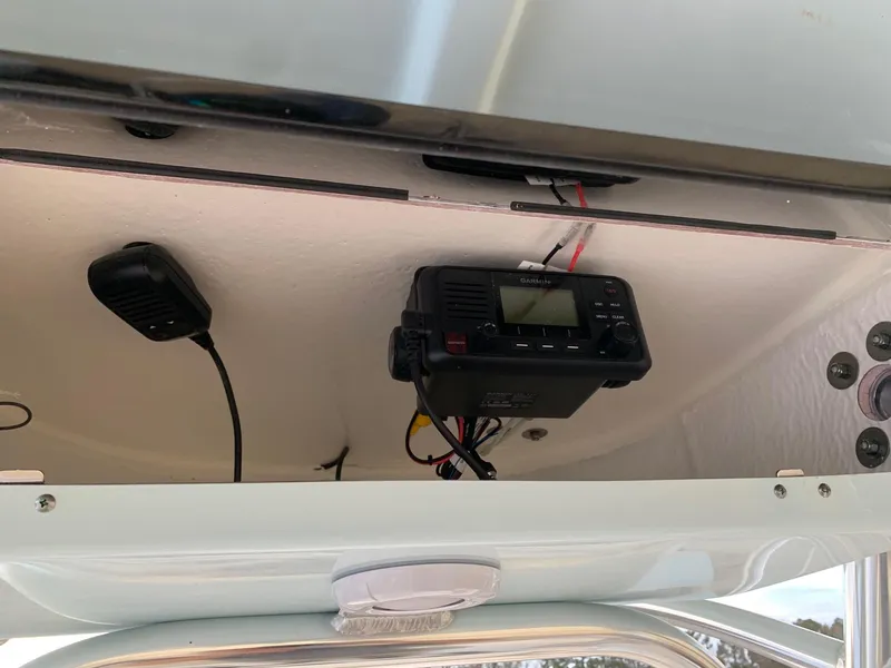 Slide: The Image of 2024 Key West 203 FS boat dashboard with radio and microphone. - 8