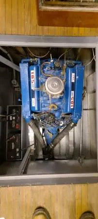 Slide: The Image of 1961 Chris-Craft Roamer engine, blue, in a boat's engine compartment. - 14
