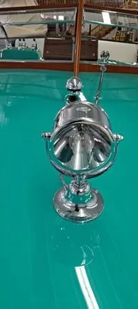 Slide: The Image of 1961 Chris-Craft Roamer boat with polished chrome details on a teal deck. - 21