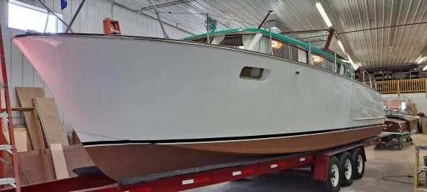 Slide: The Image of 1961 Chris-Craft Roamer boat on trailer in indoor storage facility. - 7