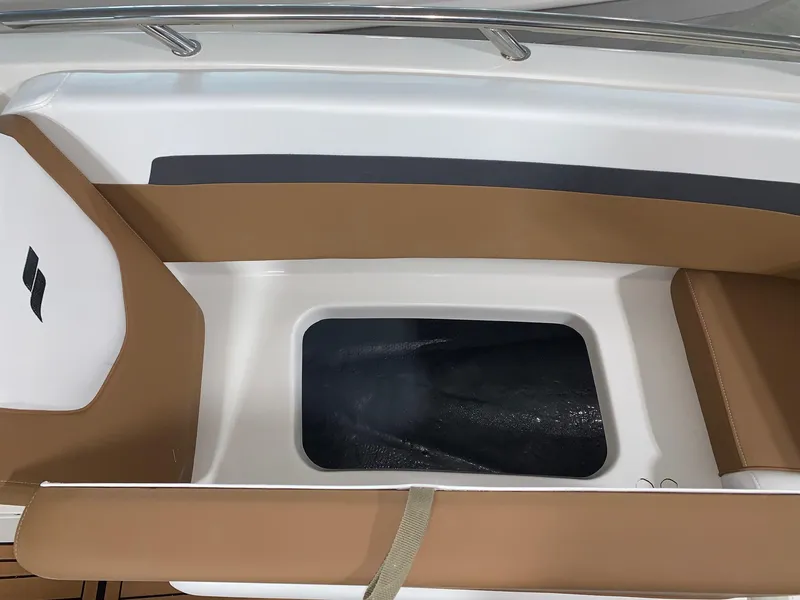 Slide: The Image of 2024 Starcraft SVX 211 boat seating area with storage compartment. - 10