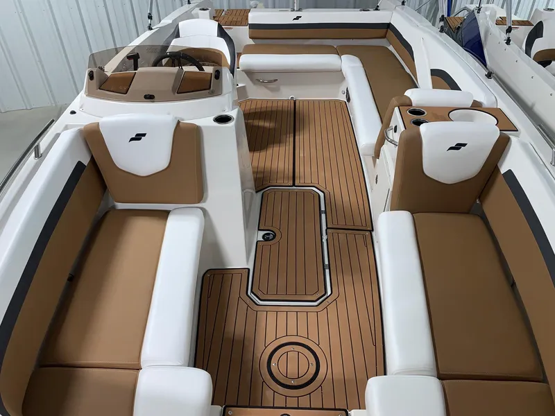 Slide: The Image of 2024 Starcraft SVX 211 boat interior with tan and white seating. - 11