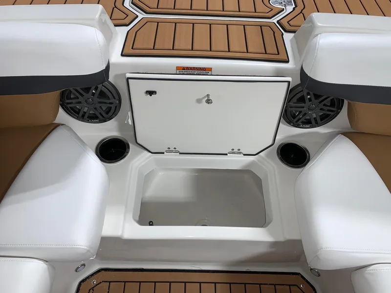 Slide: The Image of 2024 Starcraft SVX 211 boat interior with storage compartment and seating. - 4