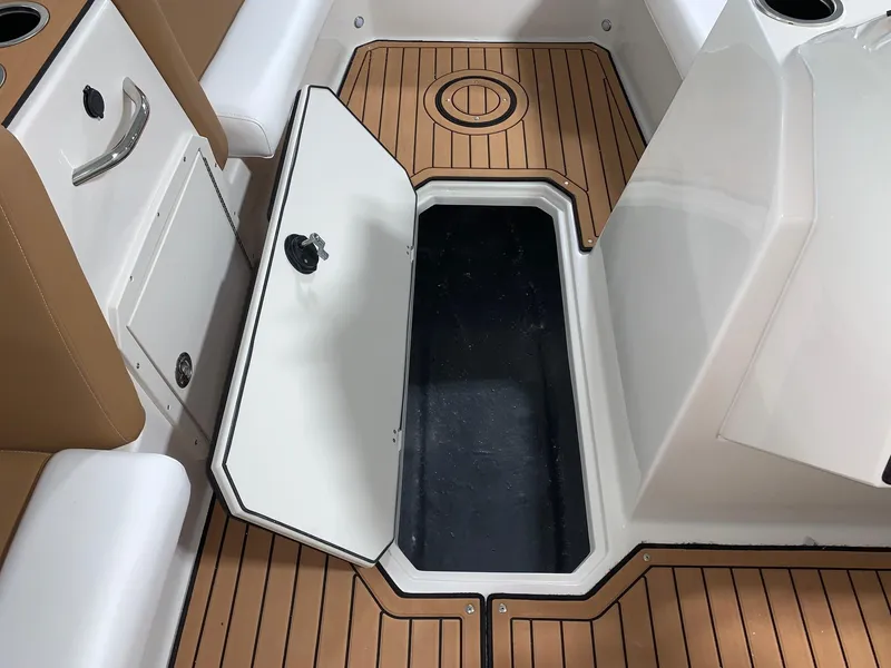 Slide: The Image of 2024 Starcraft SVX 211 boat interior with open storage compartment. - 6