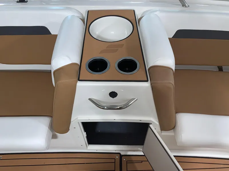 Slide: The Image of 2024 Starcraft SVX 211 boat interior with cup holders and storage compartment. - 8