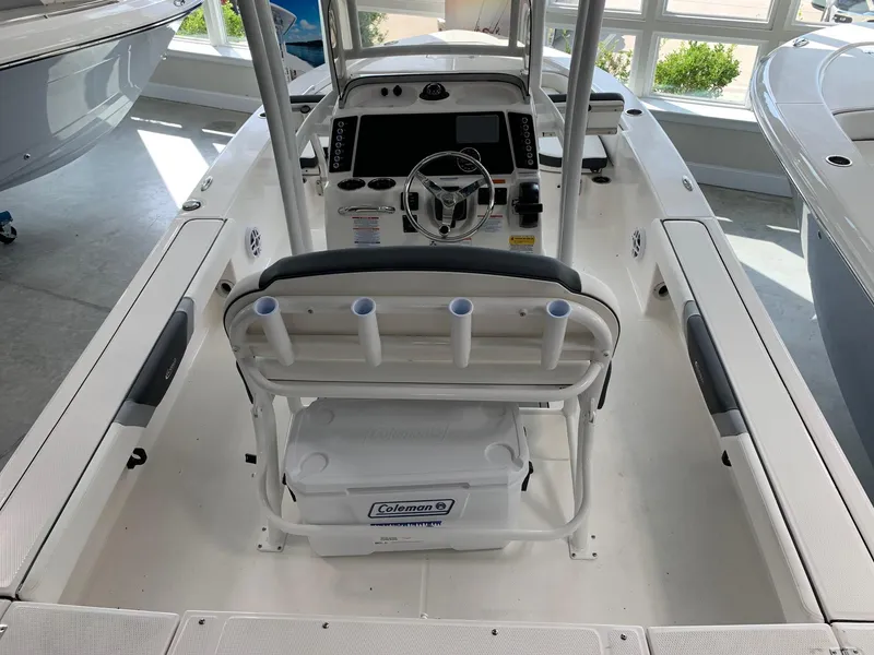 Slide: The Image of 2024 Robalo 226 Cayman boat interior with console and seating. - 2