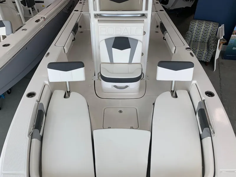 Slide: The Image of 2024 Robalo 226 Cayman boat interior with seating and storage compartments. - 3