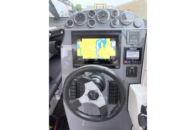 Slide: The Image of Steering console of 2012 Protector Targa 30 with navigation display and gauges. - 8