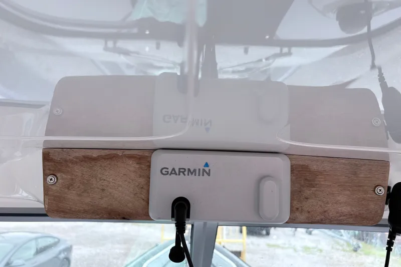 Slide: The Image of Garmin device mounted on a 2012 Protector Targa 30 boat dashboard. - 9