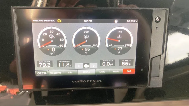 Slide: The Image of Dashboard display of a 2021 Regal LS2 Surf boat showing engine metrics and controls. - 10