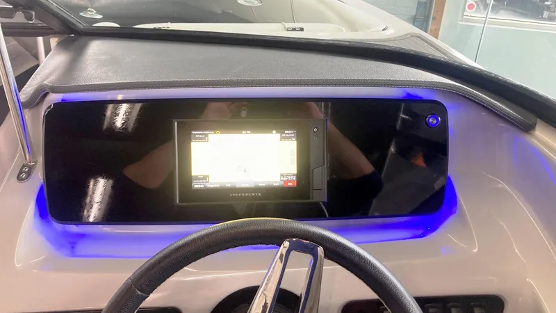 Slide: The Image of Dashboard of 2021 Regal LS2 Surf boat with illuminated touchscreen display. - 11