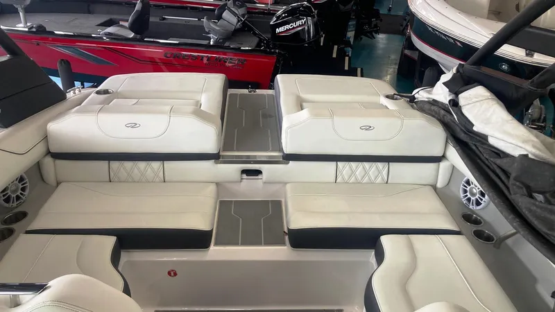 Slide: The Image of 2021 Regal LS2 Surf boat interior with white seating and modern design. - 2