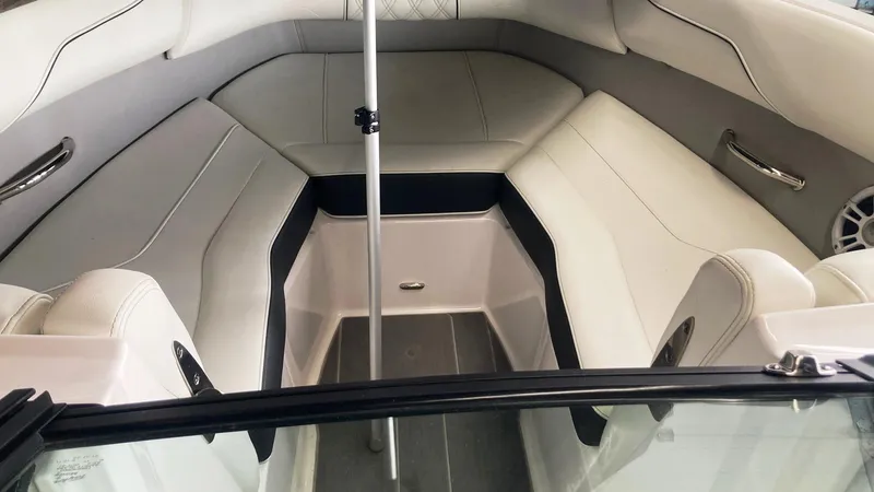 Slide: The Image of 2021 Regal LS2 Surf boat interior with white seating and sleek design. - 8