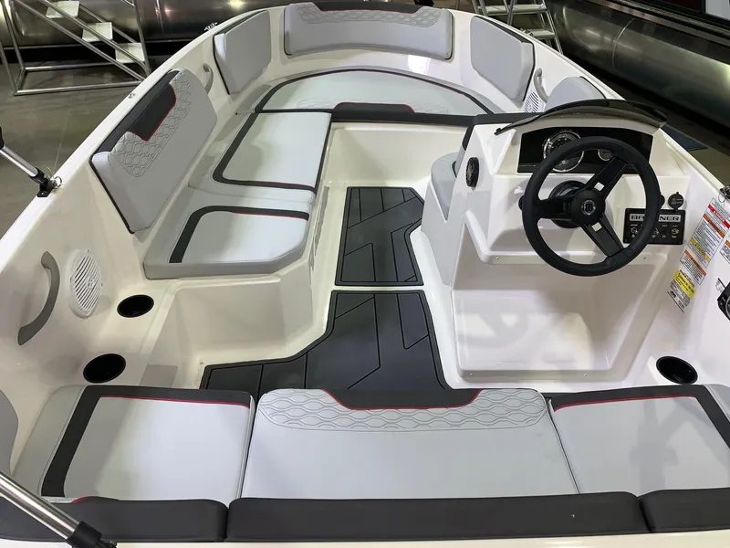 Slide: The Image of 2024 Bayliner Element M15 boat interior with seating and steering console. - 3