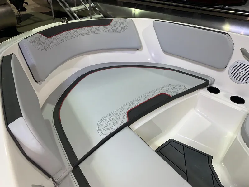 Slide: The Image of 2024 Bayliner Element M15 boat interior with cushioned seating and cup holders. - 6