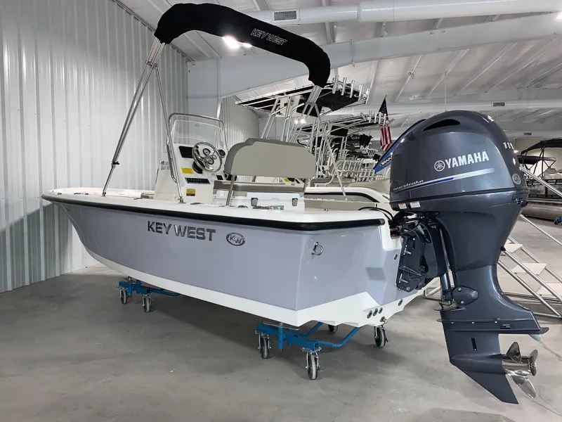 Slide: The Image of 2024 Key West 188 Bay Reef boat with Yamaha outboard motor in showroom. - 0