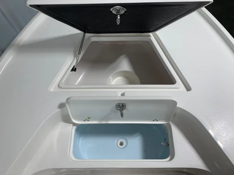 Slide: The Image of 2024 Key West 188 Bay Reef boat storage compartments and livewell. - 13