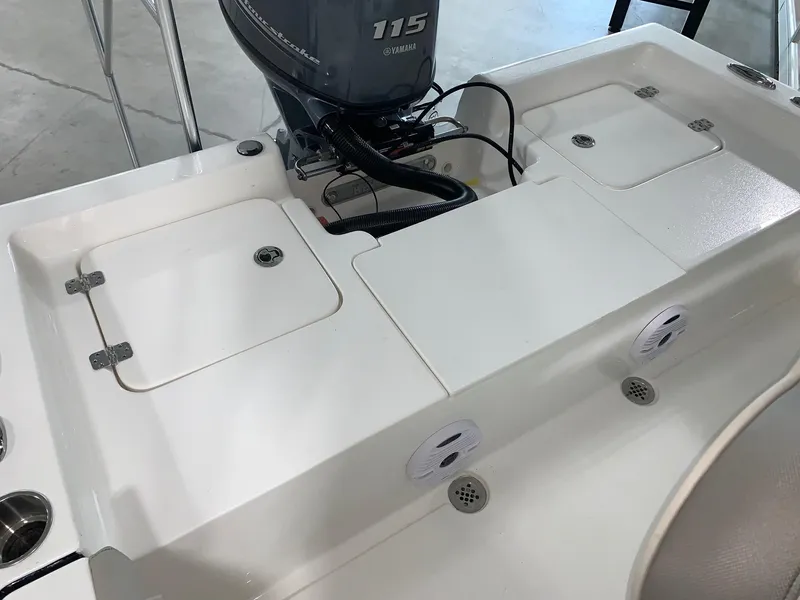 Slide: The Image of 2024 Key West 188 Bay Reef boat with Yamaha 115 engine, rear deck view. - 5