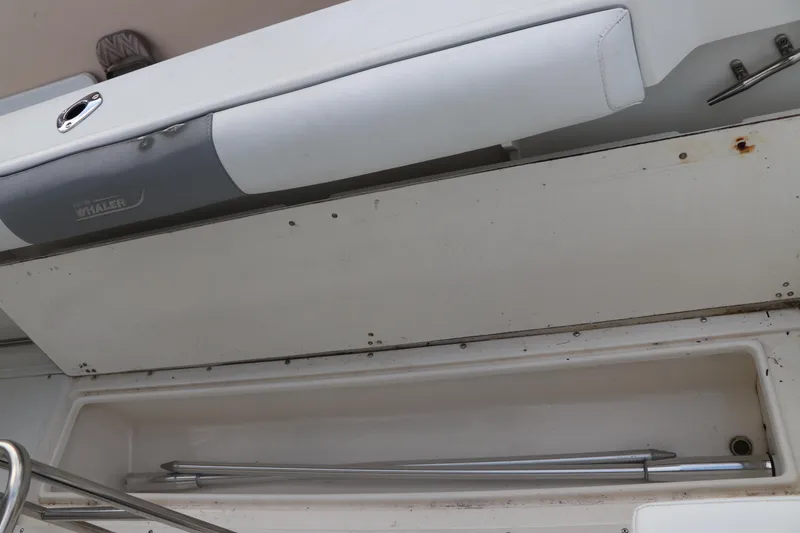 Slide: The Image of Storage compartment on a 2001 Boston Whaler Outrage 26 CC boat. - 12