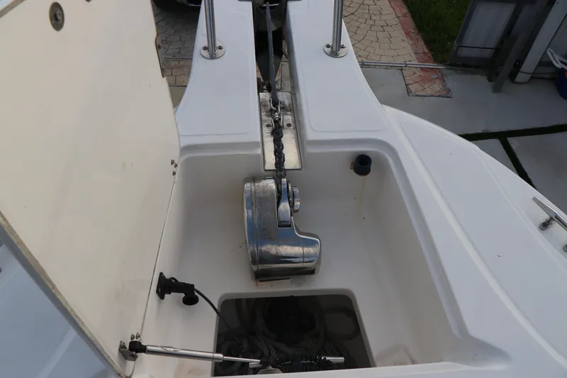 Slide: The Image of Anchor compartment of a 2001 Boston Whaler Outrage 26 CC boat. - 13