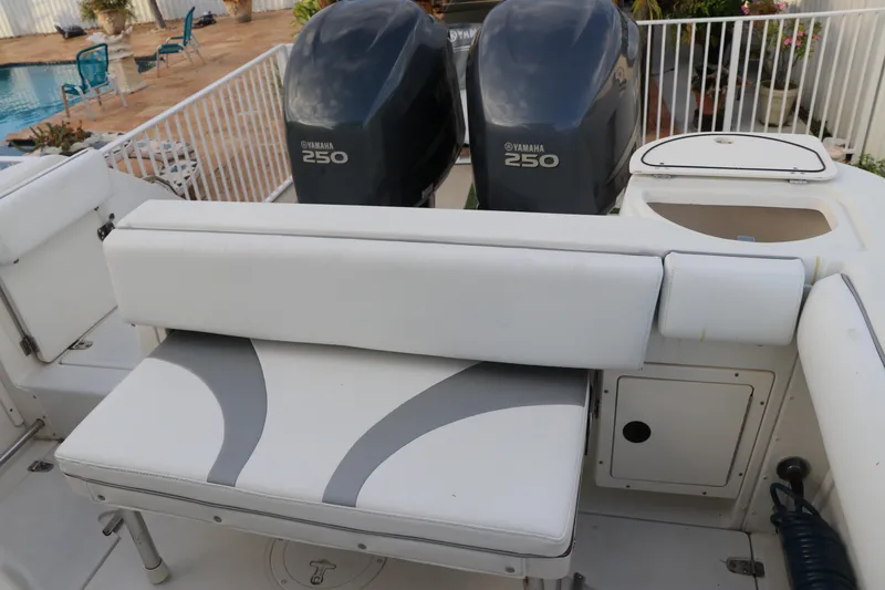Slide: The Image of Boston Whaler Outrage 26 CC 2001 boat with dual Yamaha 250 engines and cushioned seating. - 14