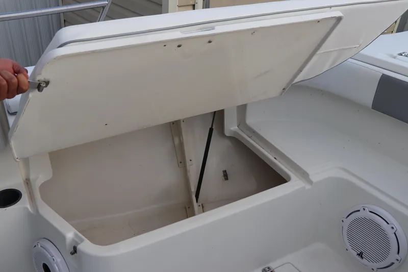 Slide: The Image of Open storage compartment on a 2001 Boston Whaler Outrage 26 CC boat. - 18