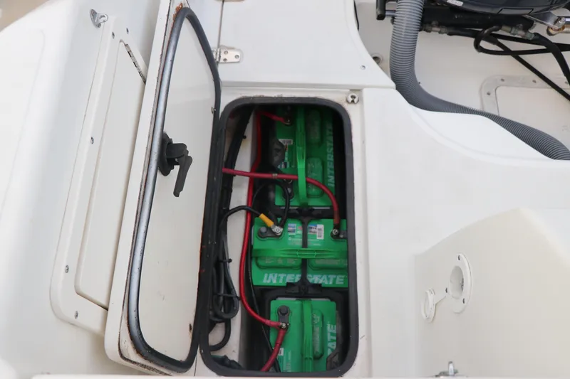 Slide: The Image of Battery compartment of 2001 Boston Whaler Outrage 26 CC with green Interstate batteries. - 21