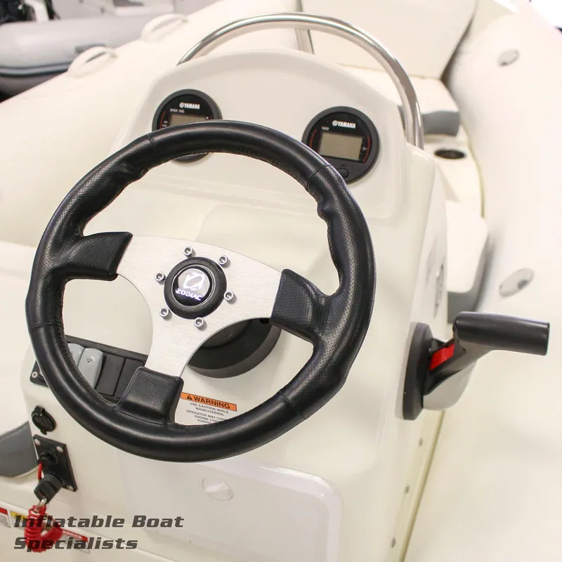 Slide: The Image of Zodiac Yachtline 490 2024 steering console with Yamaha gauges and controls. - 2