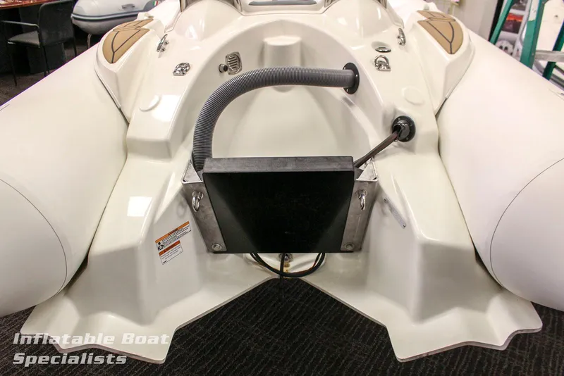 Slide: The Image of 2024 Zodiac Yachtline 490 inflatable boat, rear view, showcasing engine mount and accessories. - 3