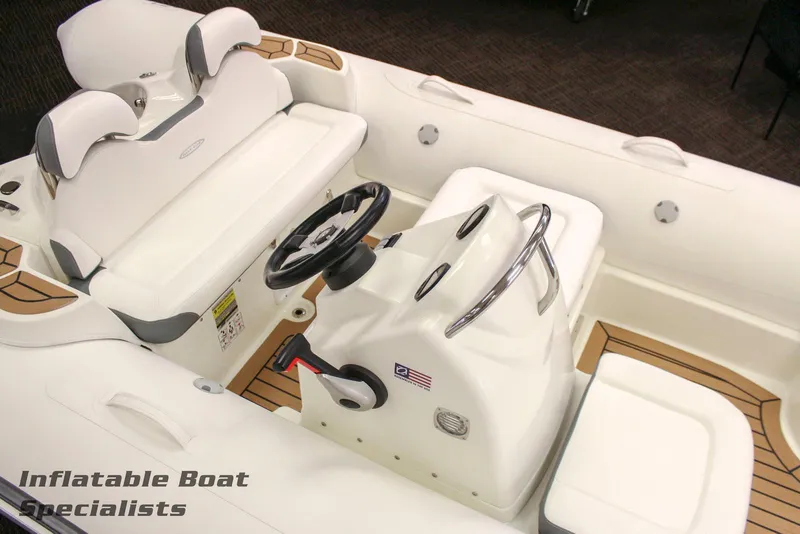 Slide: The Image of 2024 Zodiac Yachtline 490 inflatable boat interior with steering console and seating. - 5