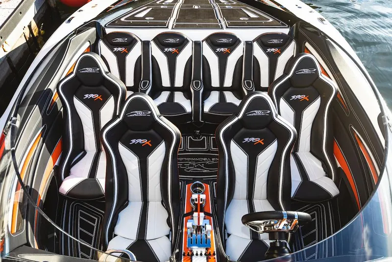Slide: The Image of Interior of 2025 MTI 390X speedboat with stylish seating arrangement. - 2