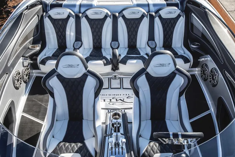 Slide: The Image of 2024 MTI 340X boat interior with luxurious seating and modern design. - 2