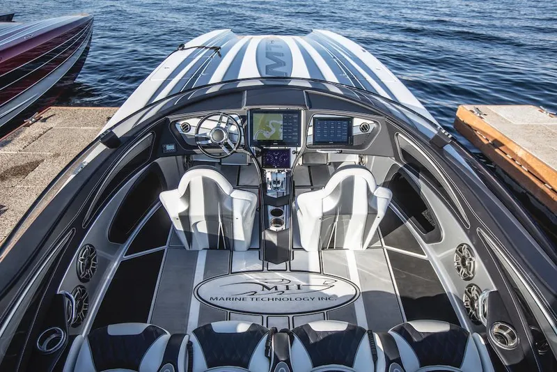 Slide: The Image of 2024 MTI 340X boat interior with advanced navigation system and luxurious seating. - 3