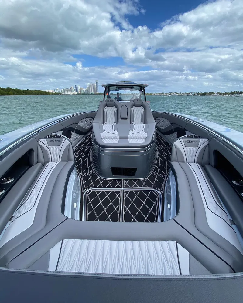 Slide: The Image of 2025 MTI V50 luxury speedboat with modern seating on open water. - 4