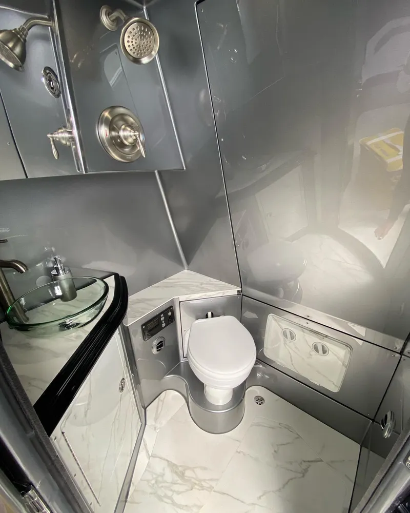 Slide: The Image of Modern MTI V50 2025 bathroom with sleek fixtures and marble flooring. - 8