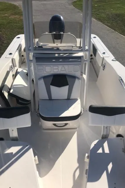 Slide: The Image of 2024 Robalo R200 Center Console boat interior with seating and console. - 11