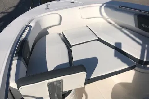 Slide: The Image of 2024 Robalo R200 Center Console boat seating area with white and gray cushions. - 13