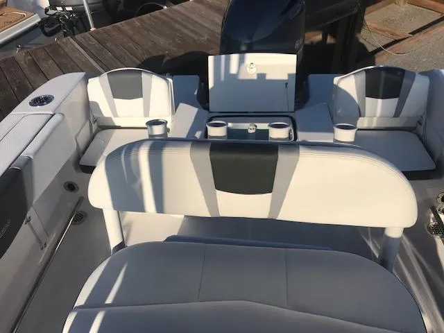 Slide: The Image of 2024 Robalo R200 Center Console boat interior with seating and cup holders. - 7