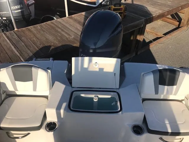 Slide: The Image of 2024 Robalo R200 Center Console boat with seating and engine. - 6