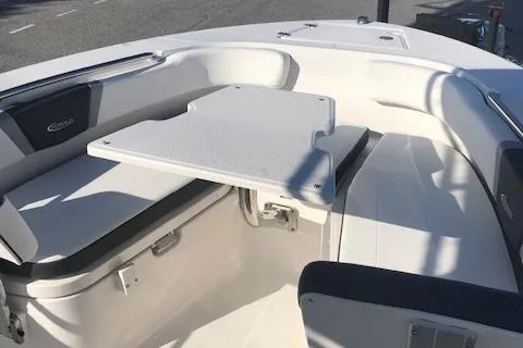 Slide: The Image of 2024 Robalo R200 Center Console boat seating and table area. - 8
