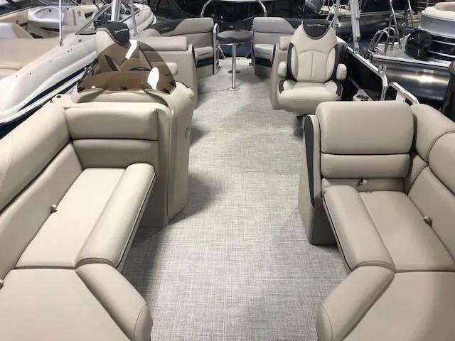 Slide: The Image of 2023 South Bay 224RS LE 2.75 pontoon boat interior with beige seating and modern design. - 6