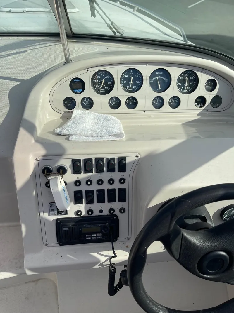 Slide: The Image of 1992 Regal Ventura boat dashboard with gauges and controls. - 6