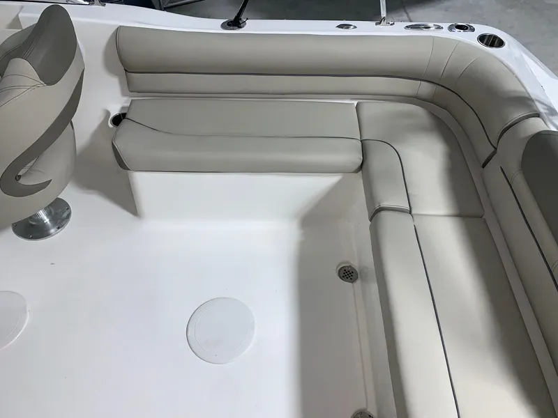 Slide: The Image of 2024 Key West 203 DFS boat interior with cushioned seating. - 12