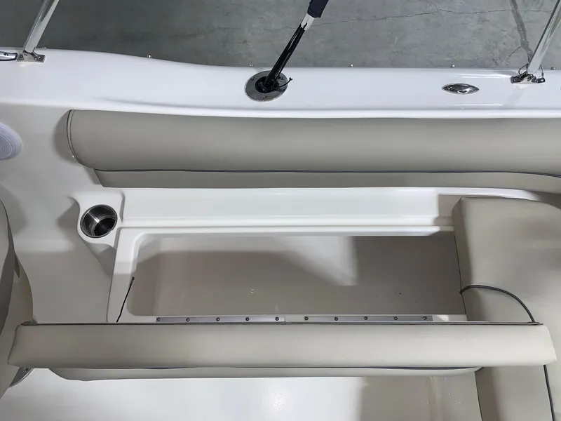 Slide: The Image of 2024 Key West 203 DFS boat interior seating and storage compartment. - 13