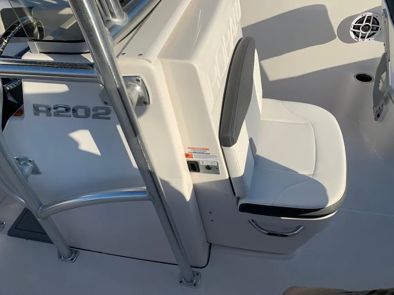 Slide: The Image of 2024 Robalo R202 Explorer boat interior with seating and console. - 13